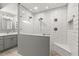 Spa-like shower with a built-in seat and pebble flooring at 2376 Hanover Dr, Dunedin, FL 34698