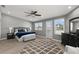 Large main bedroom with king-size bed, private balcony access, and ample closet space at 2376 Hanover Dr, Dunedin, FL 34698