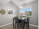 Cozy dining area features a dark wood table and chairs, with a view at 2376 Hanover Dr, Dunedin, FL 34698