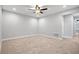 Bright bedroom with ceiling fan and neutral carpeting at 2503 Arch Ave # 139W, Oldsmar, FL 34677