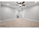 Spacious bedroom with ceiling fan and neutral carpeting at 2503 Arch Ave # 139W, Oldsmar, FL 34677