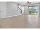 Spacious living room with tile floors, sliding glass doors, and a view of the backyard at 2503 Arch Ave # 139W, Oldsmar, FL 34677