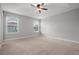 Large bedroom with ceiling fan and neutral carpeting at 2503 Arch Ave # 139W, Oldsmar, FL 34677