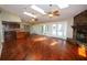 Spacious living room with hardwood floors, fireplace and access to pool at 7119 Burlington N Ave, St Petersburg, FL 33710