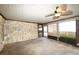 Cozy screened porch with stone accent wall and tile floor at 824 62Nd Ne Ave, St Petersburg, FL 33702