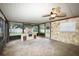 Relaxing screened porch featuring a stone fireplace at 824 62Nd Ne Ave, St Petersburg, FL 33702
