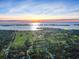 Aerial view of community with golf course, bay, skyline, and waterfront at 100 Oakmont Ln # 301, Belleair, FL 33756