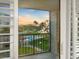 Enjoy breathtaking sunset views from the balcony overlooking the pool and lush tropical landscaping at 100 Oakmont Ln # 301, Belleair, FL 33756