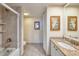 Bathroom features a shower with glass door, granite countertop vanity, and neutral tile flooring at 100 Oakmont Ln # 301, Belleair, FL 33756