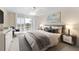 Stylish bedroom with sleek furniture and decor, featuring a balcony and views at 100 Oakmont Ln # 301, Belleair, FL 33756