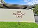 Elegant entrance sign showcasing the community name and address, enhancing curb appeal at 100 Oakmont Ln # 301, Belleair, FL 33756