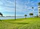 Well-maintained lawn with a view of the bay and the city skyline, offering a peaceful outdoor space at 100 Oakmont Ln # 301, Belleair, FL 33756