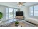 Bright living room featuring a ceiling fan, and waterfront views at 100 Oakmont Ln # 301, Belleair, FL 33756