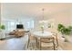 Bright living room featuring neutral colors, large windows, and comfortable seating, great for relaxing and entertaining at 100 Oakmont Ln # 301, Belleair, FL 33756