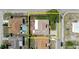 Aerial view showcasing the property layout with backyard, patio, and neighboring houses at 1172 Chelsea Ln, Holiday, FL 34691