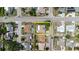 A bird's eye view showcases this single-Gathering home with a neutral palette roof and a cozy backyard patio at 1172 Chelsea Ln, Holiday, FL 34691