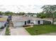 A cozy single Gathering home including landscaping and a driveway at 1172 Chelsea Ln, Holiday, FL 34691