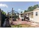 Well-appointed brick patio with a metal gazebo, outdoor grill area, providing space for outdoor activities at 1172 Chelsea Ln, Holiday, FL 34691
