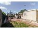 Backyard brick patio includes a utility shed, grill area, and a metal gazebo with room for entertainment at 1172 Chelsea Ln, Holiday, FL 34691