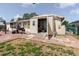Outdoor space with a brick patio, BBQ grill, storage shed, and partial grass area at 1172 Chelsea Ln, Holiday, FL 34691