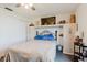 Cozy bedroom with a comfortable bed, built-in cabinets, and stylish decor accents at 1172 Chelsea Ln, Holiday, FL 34691