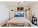 Bedroom features a bed, ceiling fan, a wardrobe, and neutral decor at 1172 Chelsea Ln, Holiday, FL 34691