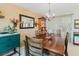 Dining room featuring a large wooden table and decorative hutch at 1172 Chelsea Ln, Holiday, FL 34691