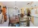Formal dining room with a view of the kitchen area and a dark wood dining table at 1172 Chelsea Ln, Holiday, FL 34691