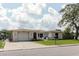 A cozy home featuring a yard and close proximity to the street at 1172 Chelsea Ln, Holiday, FL 34691