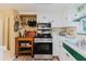 Modern kitchen with stainless steel appliances and light colored cabinets at 1172 Chelsea Ln, Holiday, FL 34691