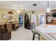 Bright kitchen view features a stainless steel refrigerator and a home office area at 1172 Chelsea Ln, Holiday, FL 34691