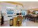 Inviting eat-in kitchen featuring bar seating, modern appliances, and seamless access to the dining area at 1172 Chelsea Ln, Holiday, FL 34691