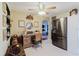 Interior view of kitchen featuring stainless steel refrigerator and a home office area at 1172 Chelsea Ln, Holiday, FL 34691