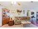 The living room boasts an inviting atmosphere and decor with ceiling fan and neutral tones at 1172 Chelsea Ln, Holiday, FL 34691