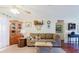 The living room boasts an inviting atmosphere and decor with ceiling fan and neutral tones at 1172 Chelsea Ln, Holiday, FL 34691