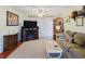 Living room with neutral carpet, a fireplace, ceiling fan, and a comfortable sofa at 1172 Chelsea Ln, Holiday, FL 34691