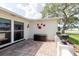 Outdoor patio featuring decorative wall art, tiled flooring, and ample space for outdoor enjoyment at 1172 Chelsea Ln, Holiday, FL 34691