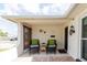 This front patio features brick flooring and seating at 1172 Chelsea Ln, Holiday, FL 34691