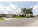 A charming house featuring a lush front yard and nearby street access at 1172 Chelsea Ln, Holiday, FL 34691