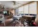 Inviting sunroom with wood flooring, natural light, and versatile layout at 1172 Chelsea Ln, Holiday, FL 34691