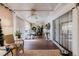Spacious sunroom with ample natural light, wood flooring, and versatile layout at 1172 Chelsea Ln, Holiday, FL 34691