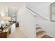 Bright entryway with a view into the living room and staircase access at 21811 Lyonia Ln, Land O Lakes, FL 34637