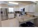 Modern kitchen with stainless steel appliances and granite countertops at 29248 Zeller Ave, San Antonio, FL 33576