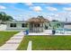 Outdoor entertaining area with tiki bar and seating at 7850 2 S Ave, St Petersburg, FL 33707