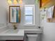 Updated bathroom features a floating vanity and a modern mirror at 7850 2 S Ave, St Petersburg, FL 33707