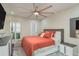 Spacious main bedroom with king-size bed and private access to balcony at 5245 Amulet Dr # 306, New Port Richey, FL 34652