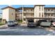 Building exterior with parking and landscaping at 5245 Amulet Dr # 306, New Port Richey, FL 34652