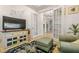Cozy sitting room with comfortable seating and built-in shelving at 709 Manns Harbor Dr, Apollo Beach, FL 33572