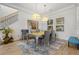 Elegant dining room with a large table and statement artwork at 709 Manns Harbor Dr, Apollo Beach, FL 33572