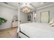 Main bedroom with large bed, dresser and ensuite access at 709 Manns Harbor Dr, Apollo Beach, FL 33572